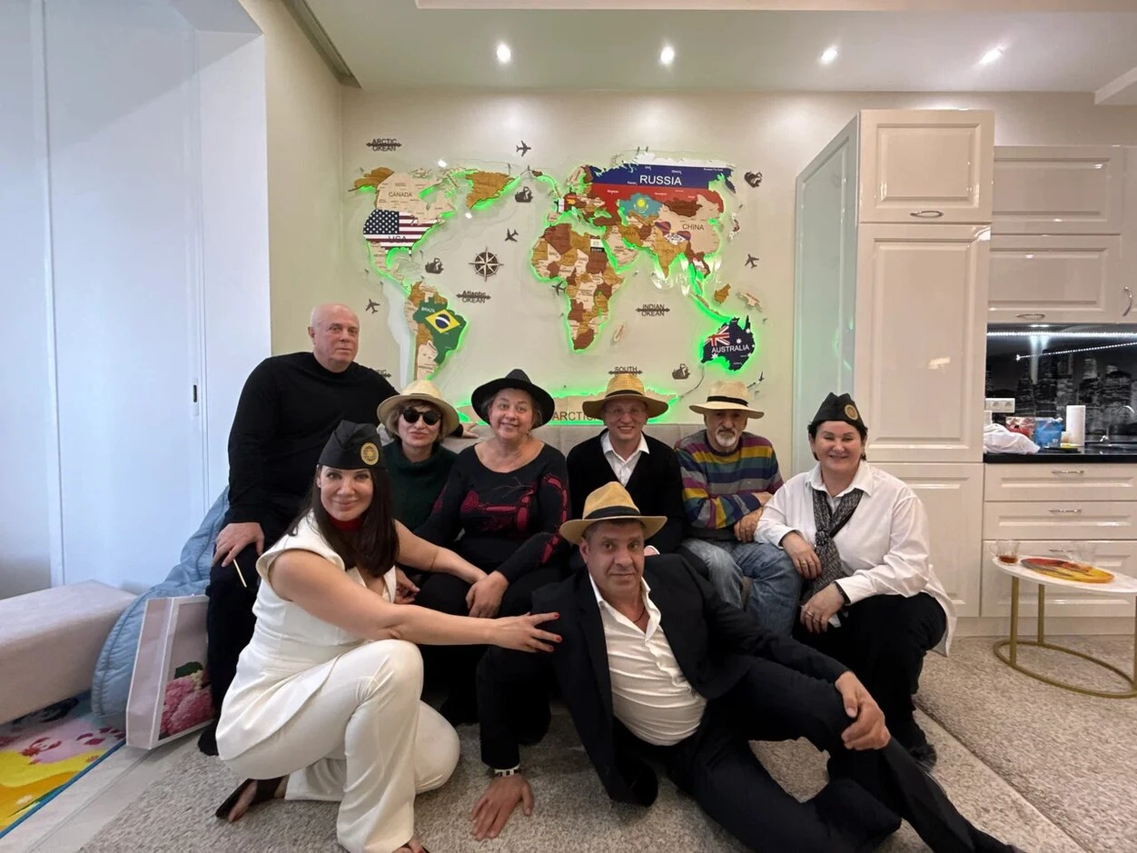 Photo Of People Sitting On Chairs